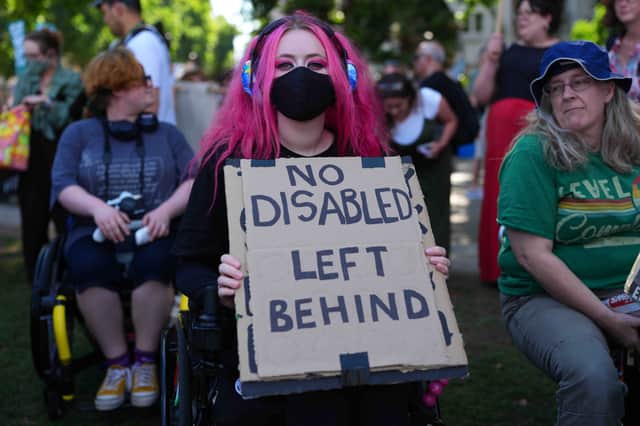 People protest against Labour's plan to cut disability benefits, which was gutted after a major backbench rebellion against it (Picture: Carl Court)