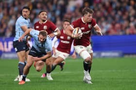 Huw Jones breaks free after good work from fellow Scot Sione Tuipulotu to score Lions' opening try.
