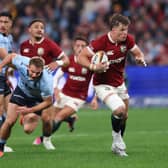 Huw Jones breaks free after good work from fellow Scot Sione Tuipulotu to score Lions' opening try.