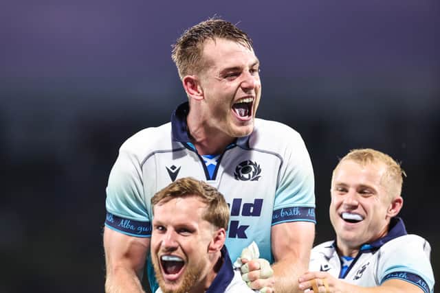 Scotland's Stafford McDowall, top, celebrates with Rory Hutchinson and Arron Reed after the win over the Maori All Blacks.