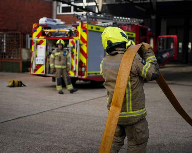 Firefighters running through a practice drill
