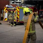 Firefighters running through a practice drill