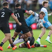 Scotland's Stafford McDowall (R) and Maori All Black's Daniel Rona (L) in action.