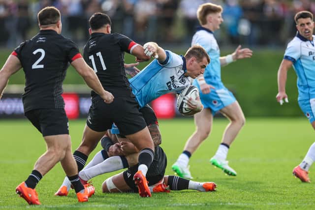 Scotland's Stafford McDowall (R) and Maori All Black's Daniel Rona (L) in action.
