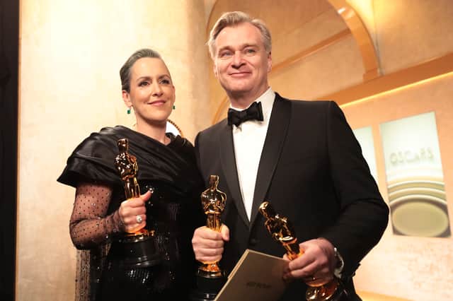 Christopher Nolan and Emma Thomas backstage after an award-filled night at the Oscars last year (Picture: Al Seib/Ampas)