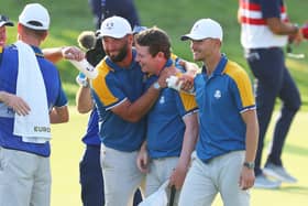 Bob MacIntyre is congratulated by Jon Rahm after winning his singles in the 2023 Ryder Cup in Rome