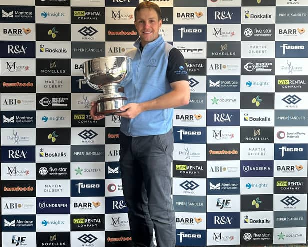 Rory Franssen shows off the trophy after winning the Cardrona Classic presented by Martin Gilbert