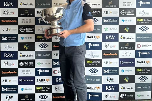 Rory Franssen shows off the trophy after winning the Cardrona Classic presented by Martin Gilbert