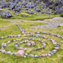 'Rock art' found by NTS rangers in Glencoe.  The charity has urged visitors to resist the trend in order to protect the countryside amid growing numbers of people visiting its sites.