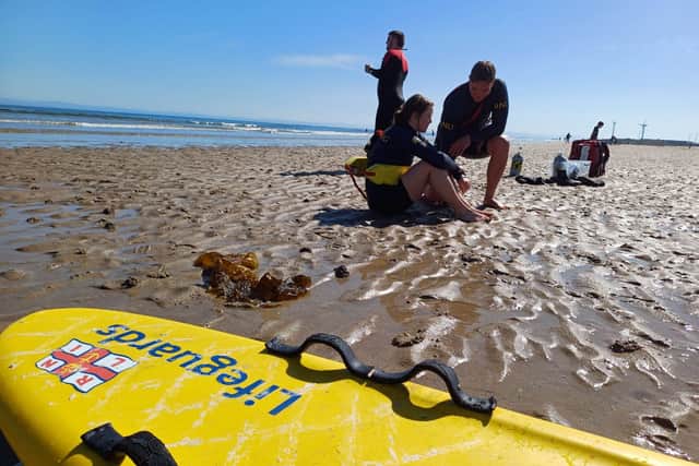 Watch: Dramatic Scottish beach rescue as paddleboarder gets into ...
