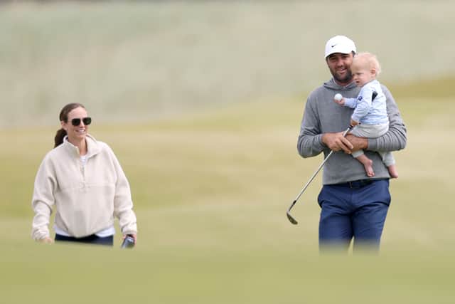 Scottie Scheffler walks on the course at The Renaissance Club with his wife Meredith and son Bennett in the build up to the Genesis Scottish Open