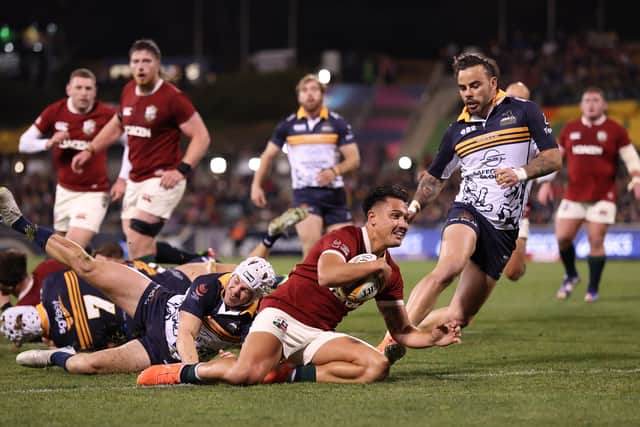 Marcus Smith scores during the Lions' win in Canberra.