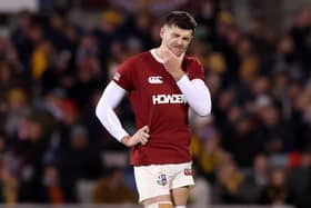 Blair Kinghorn winces after his injury concern while playing for the Lions against Brumbies.