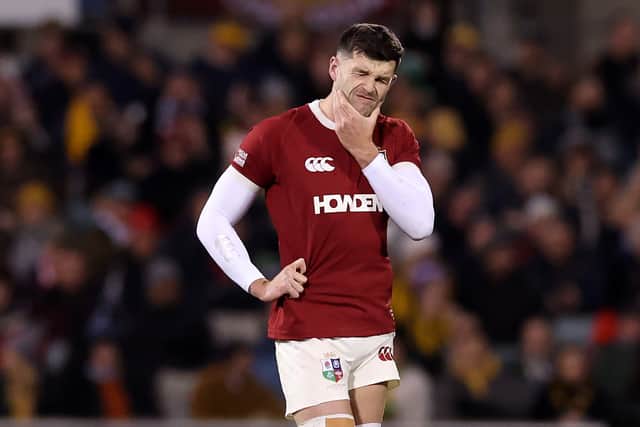 Blair Kinghorn winces after his injury concern while playing for the Lions against Brumbies.