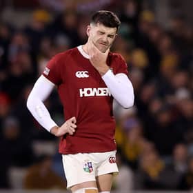 Blair Kinghorn winces after his injury concern while playing for the Lions against Brumbies.