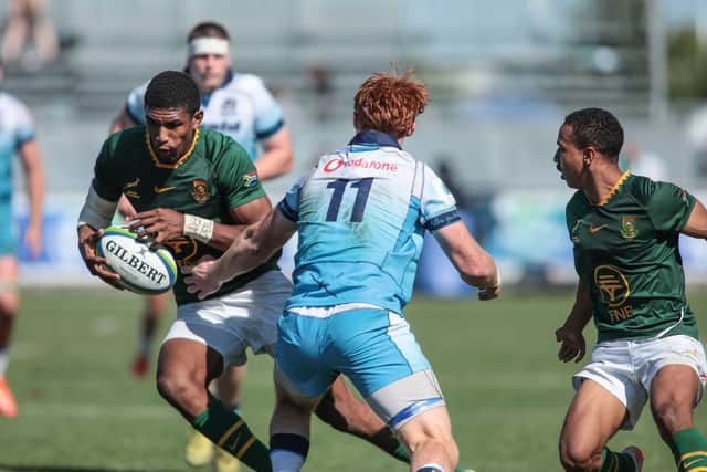 Scotland's Cameron van Wyk tries to halt a South African attack.