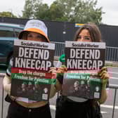 Fans hold ‘Defend Kneecap’ posters outside the Kneecap gig at the O2 Academy in Glasgow.