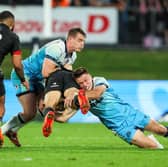 Scotland's Fergus Burke, right, shows his physical prowess as he makes a tackle during the win over New Zealand Maori in Whangarei.
