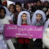 Young girls in Lebanon dress as brides during a protest against child marriage (Picture: Anwar Amro)