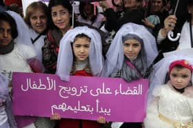 Young girls in Lebanon dress as brides during a protest against child marriage (Picture: Anwar Amro)
