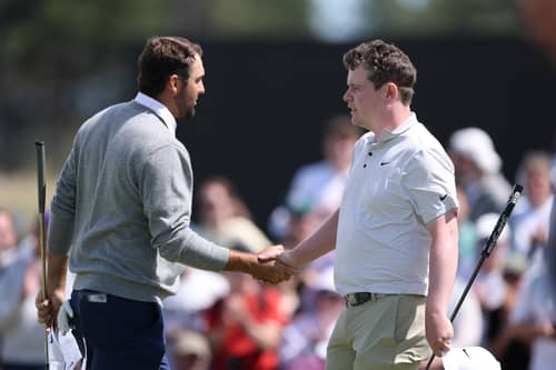 Scottie Scheffler and Bob  MacIntyre shake hands at the end of the opening round in the Genesis Scottish Open at The Renaissance Club 
