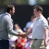 Scottie Scheffler and Bob  MacIntyre shake hands at the end of the opening round in the Genesis Scottish Open at The Renaissance Club 