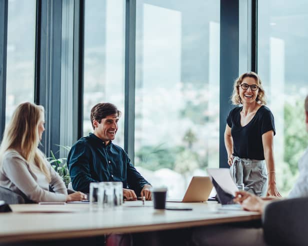 Office colleagues having casual discussion during meeting in conference room