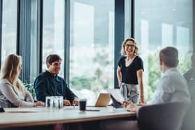 Office colleagues having casual discussion during meeting in conference room