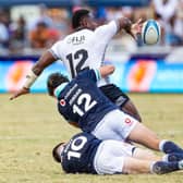 Josua Tuisova manages to offload despite the attentions of Tom Jordan and Fergus Burke.