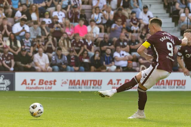 Lawrence Shankland netted two near-identical penalties as Hearts overcame Dunfermline 4-1.