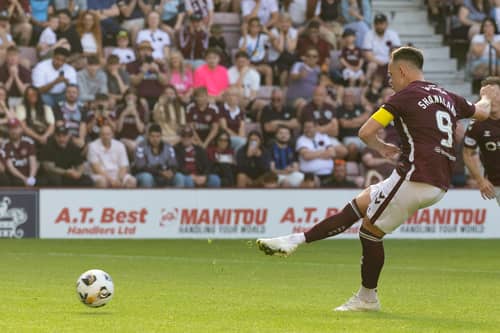 Lawrence Shankland netted two near-identical penalties as Hearts overcame Dunfermline 4-1.