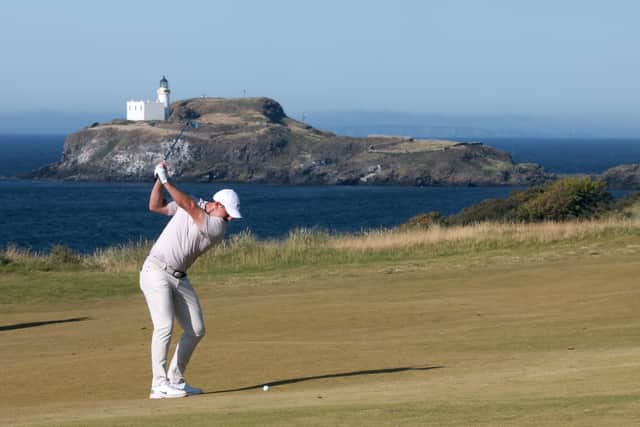 Rory McIlroy plays his second shot on the 13th hole on day three of the Genesis Scottish Open at The Renaissance Club 