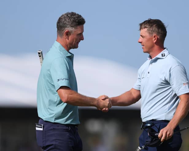 Justin Rose shakes hands with Grant Forrest on the 18th green on day four of the Genesis Scottish Open  at The Renaissance Club 