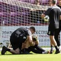 Zander Clark receives treatment before Hearts' match with Dunfermline.