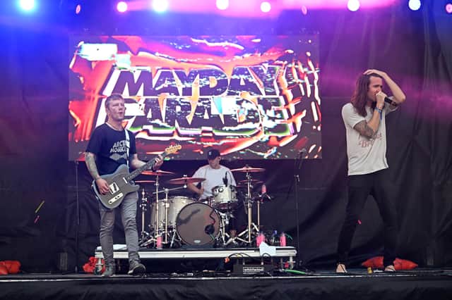 Brooks Betts, Jake Bundrick, and Derek Sanders of Mayday Parade perform on stage