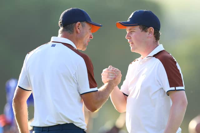 Justin Rose and Bob MacIntyre celebrate during the Saturday afternoon fourball matches in the 2023 Ryder Cup at Marco Simone Golf Club in Rome