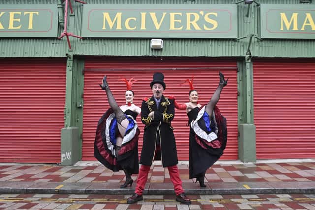 MC Puppet Paul and Can Can dancers, Amy Espie and Amber Dollin ahead of the Moulin Rouge event at the Barras Market.