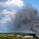 Smoke caused by a fire billows above the site of the Tomorrowland electronic music festival in Boom, northern Belgium on July 16, 2025.