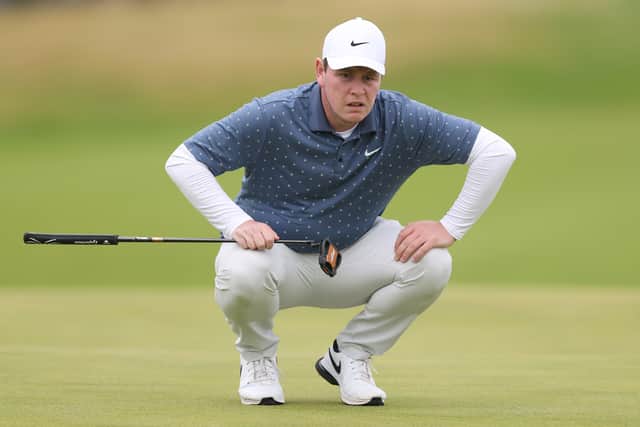 Bob MacIntyre lines up a putt  at Royal Portrush