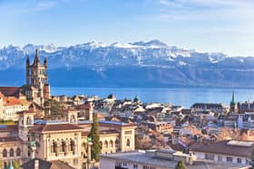 View over the city, across the lake to the Alps