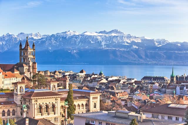View over the city, across the lake to the Alps