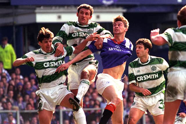 Celtic's Tony Mowbray (2nd left) climbs above Duncan Ferguson to meet a high ball in 1994.