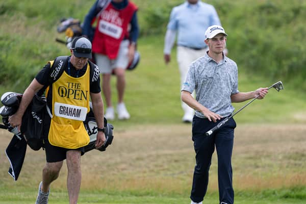 Connor Graham pictured at Royal Portrush with his coach and caddie, Fintan Bonner, during the first round of The 153rd Open