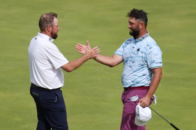 Ryder Cup team-mates Shane Lowry and Jon Rahm shake hands after finishing their round at Royal Portrush