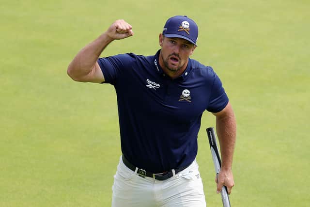 Bryson DeChambeau celebrates on the 18th green after closing with rounds of 65-68-64 at Royal Portrush