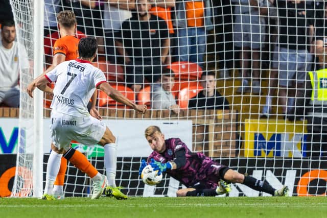 UNA Strassen's Matheus Souza (L) has a shot saved by Dundee United's Yevhen Kucherenko.