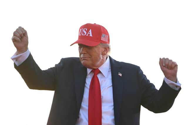 Donald Trump dances on stage at the Iowa State Fairgrounds in Des Moines earlier this month (Picture: Andrew Caballero-Reynolds)