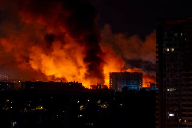 Huge clouds of smoke and flames rise into the night sky over Kyiv during mass Russian drone and missile strikes earlier this month (Picture: Oleksii Filippov)