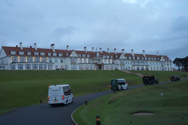 Vehicles from US President Donald Trump's motorcade make their way to Turnberry Golf Course
