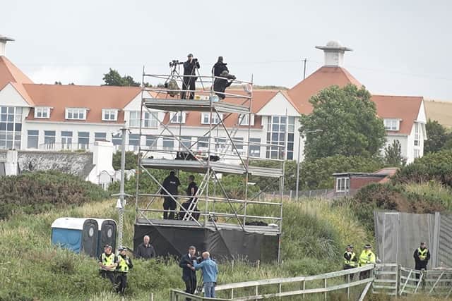 Snipers on a watchtower with their guns